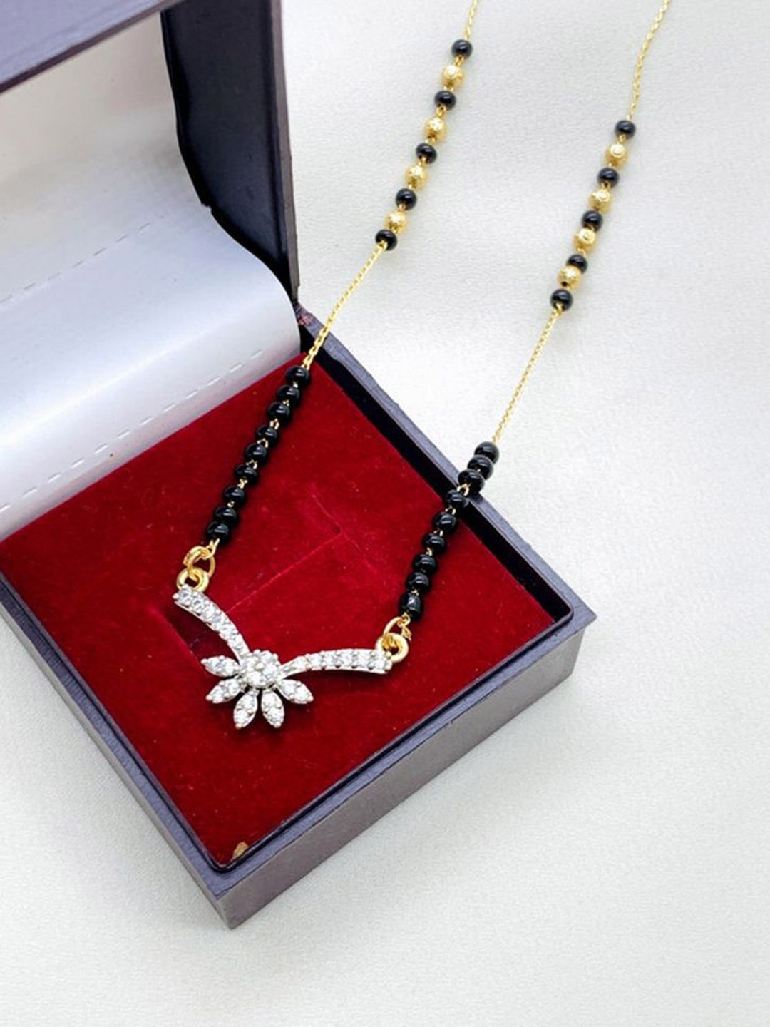 

Wynona Gold-Plated American Diamond Studded & Beaded Short Mangalsutra