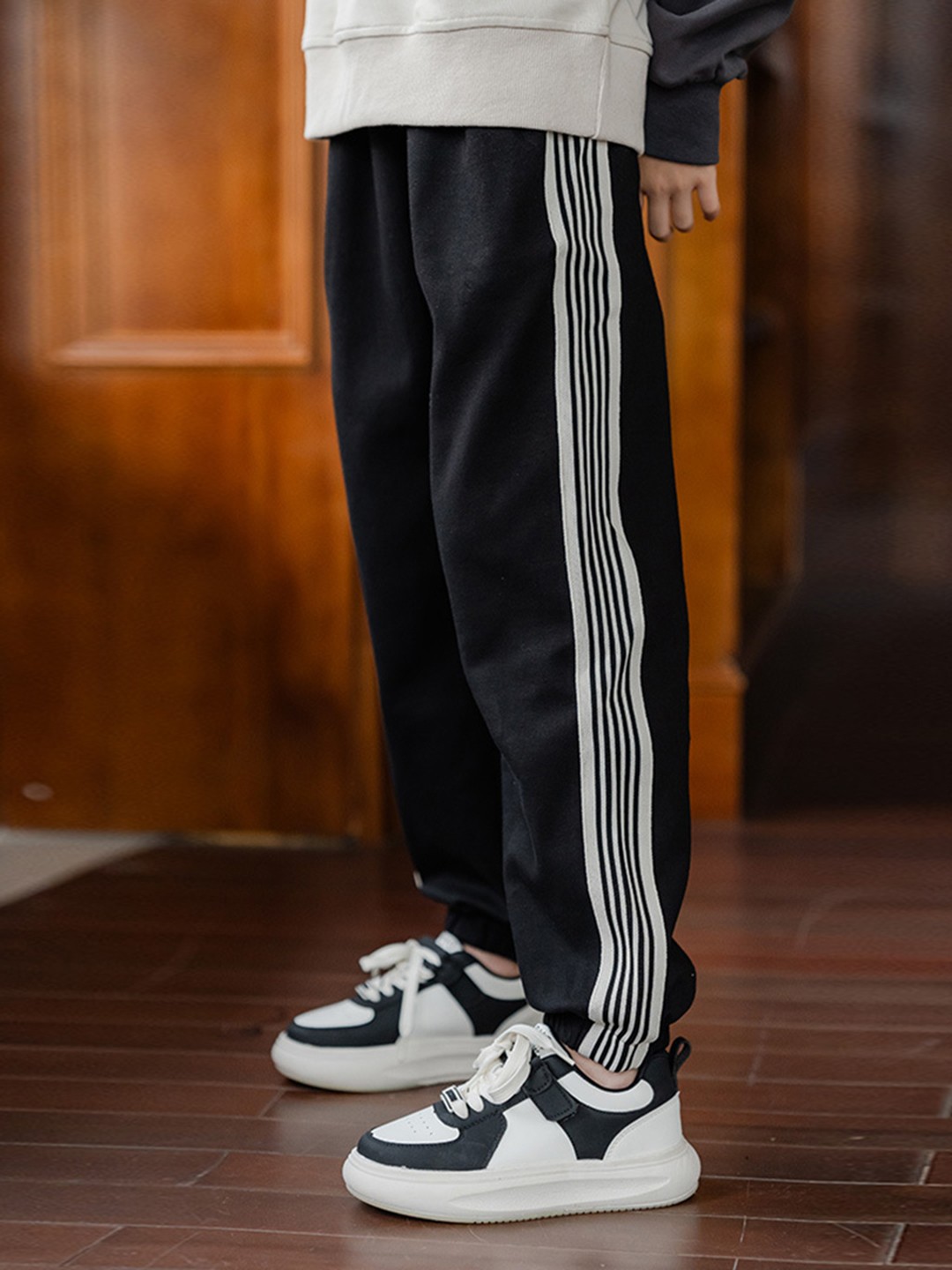 

INCLUD Girls Striped Elasticated Joggers, Black