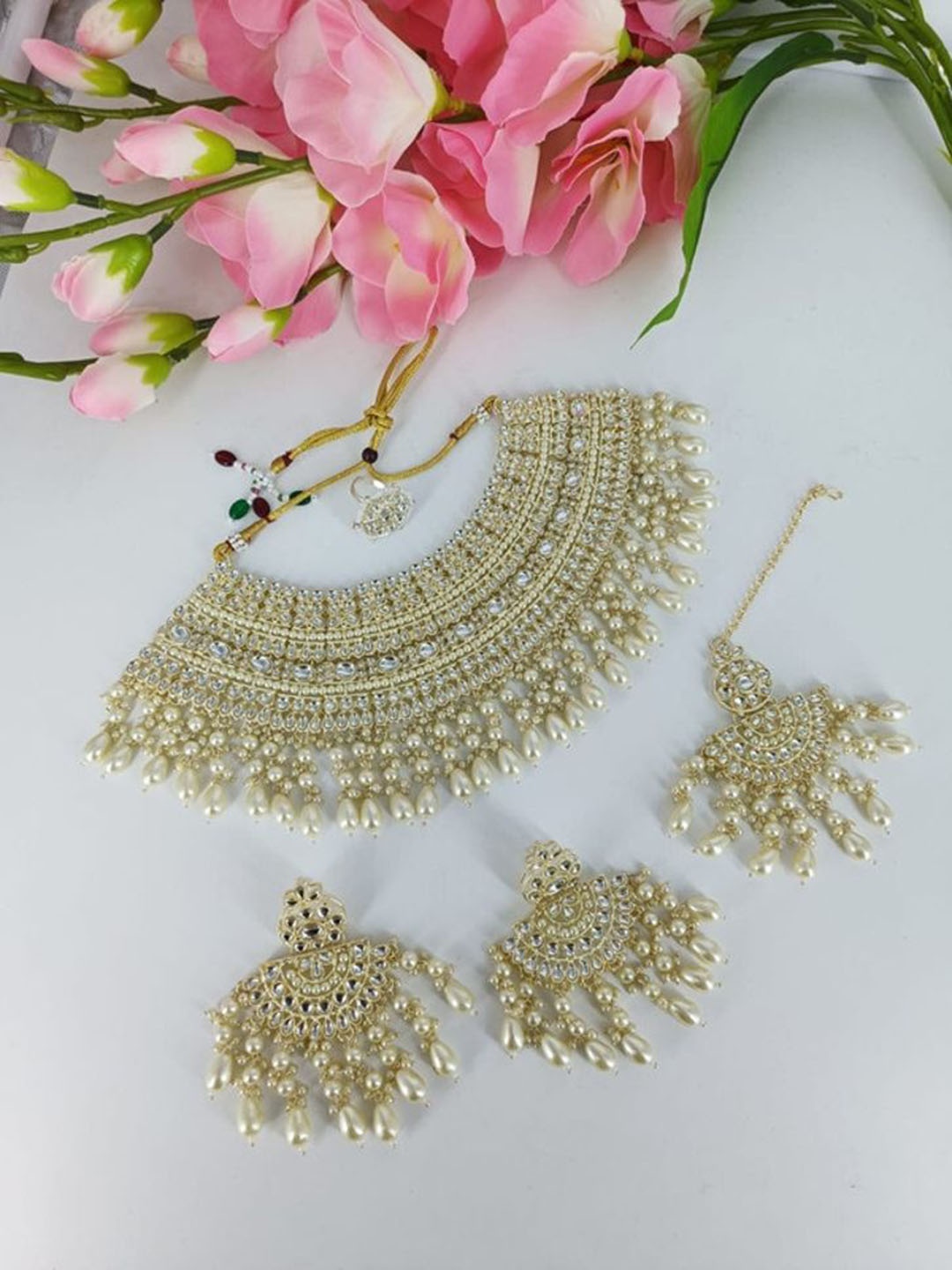

Gyaan Jewels Gold Plated Stone Studded & Beaded Jewellery Set