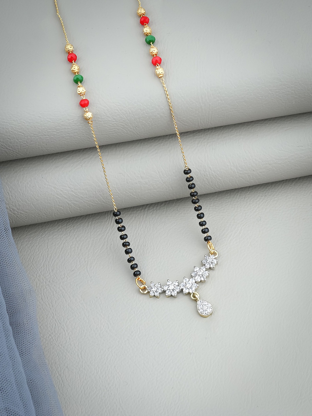 

Wynona Gold Plated American Diamond Stone Studded & Beaded Mangalsutra
