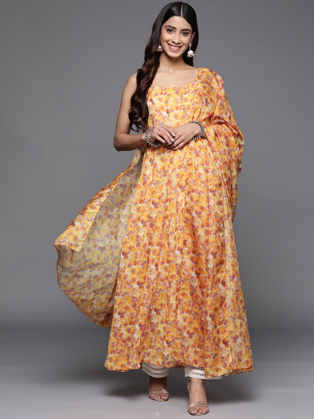 

Varanga Yellow Floral Printed Shoulder Straps Neck Sleeveless Georgette Kurta & Dupatta