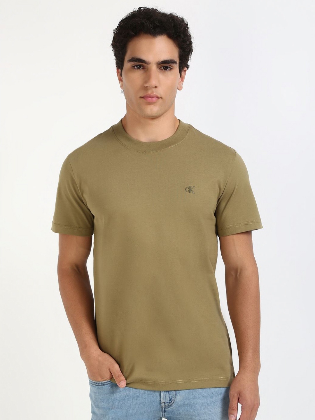 

Calvin Klein Jeans Men Solid Round Neck Cotton T-shirt, Green