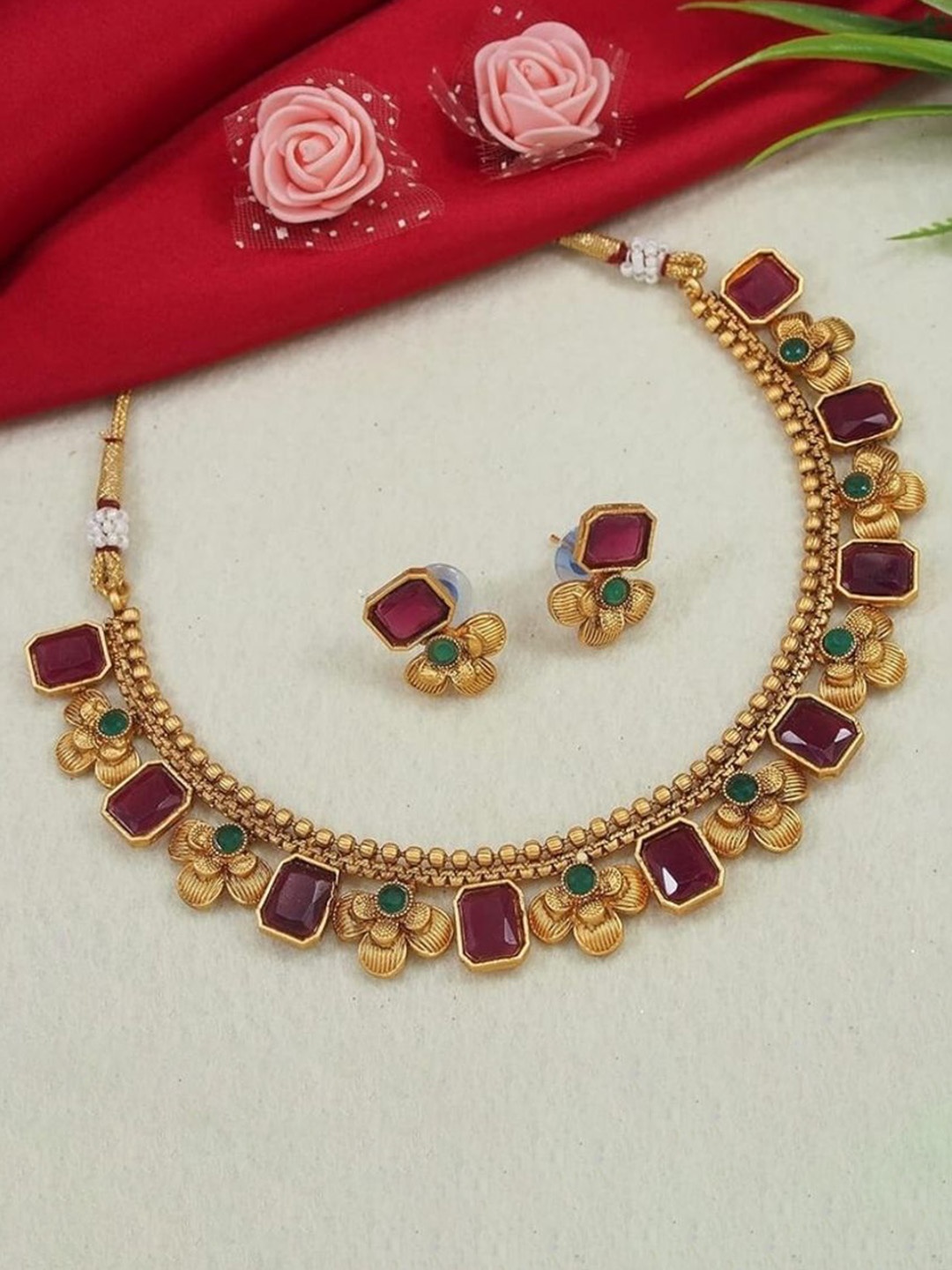 

Gyaan Jewels Gold Plated Artificial Stones Studded Jewellery Set