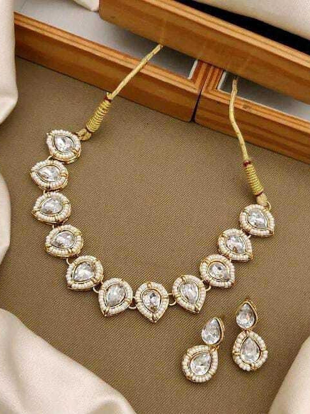 

Gyaan Jewels Gold-Plated Stone-Studded & Beaded Jewellery Set
