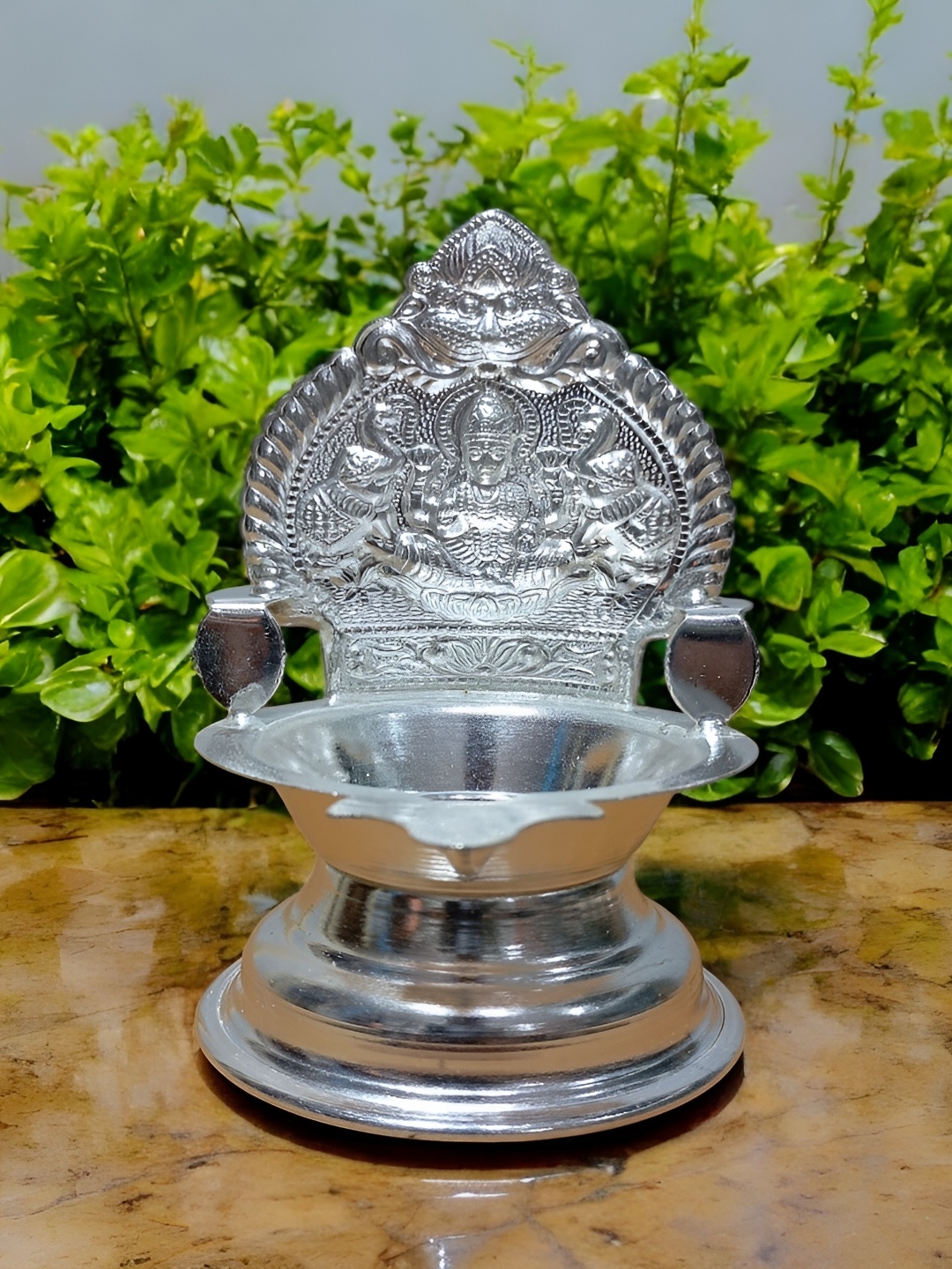 

Sigaram Glossy German Silver Kamakshi Diya