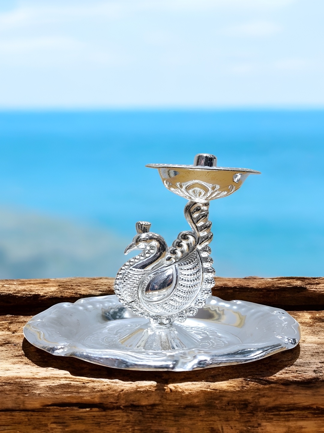 

Sigaram Silvertoned Glossy Brass Peacock Diya, Silver