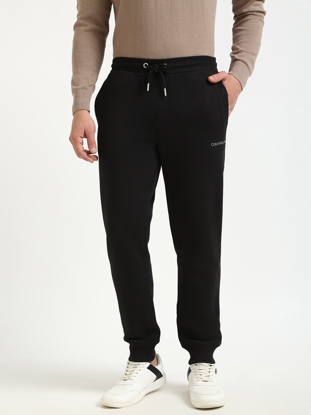 

Calvin Klein Jeans Men Mid-Rise Regular Fit Joggers Track Pants, Black
