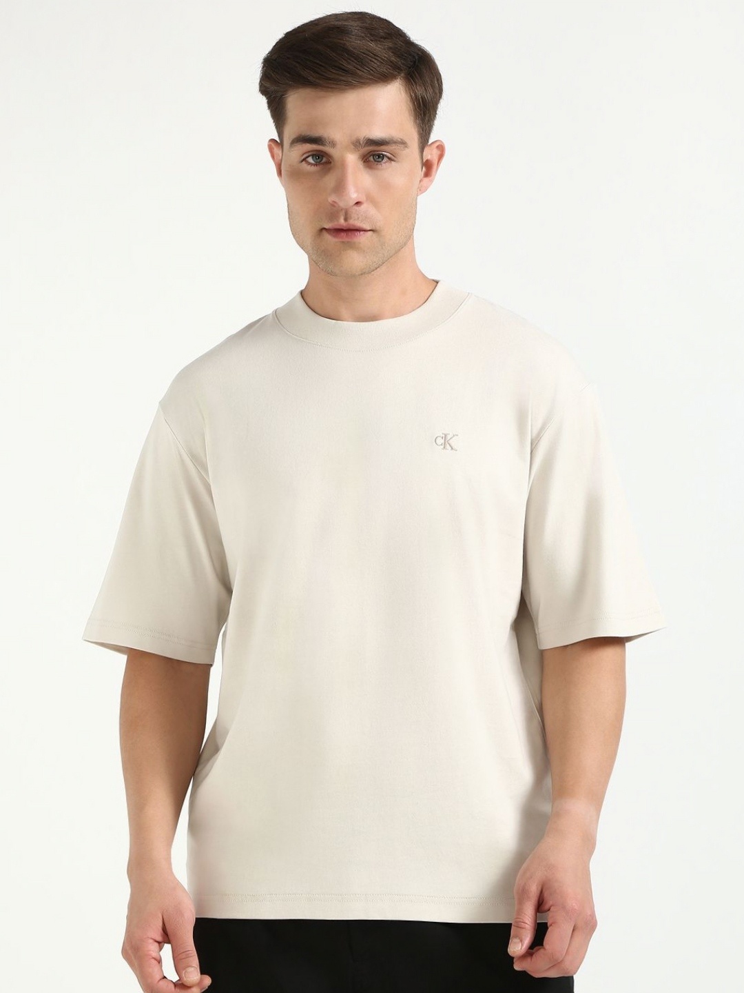 

Calvin Klein Jeans Men Solid Round Neck Cotton Relaxed Fit T-shirt, White