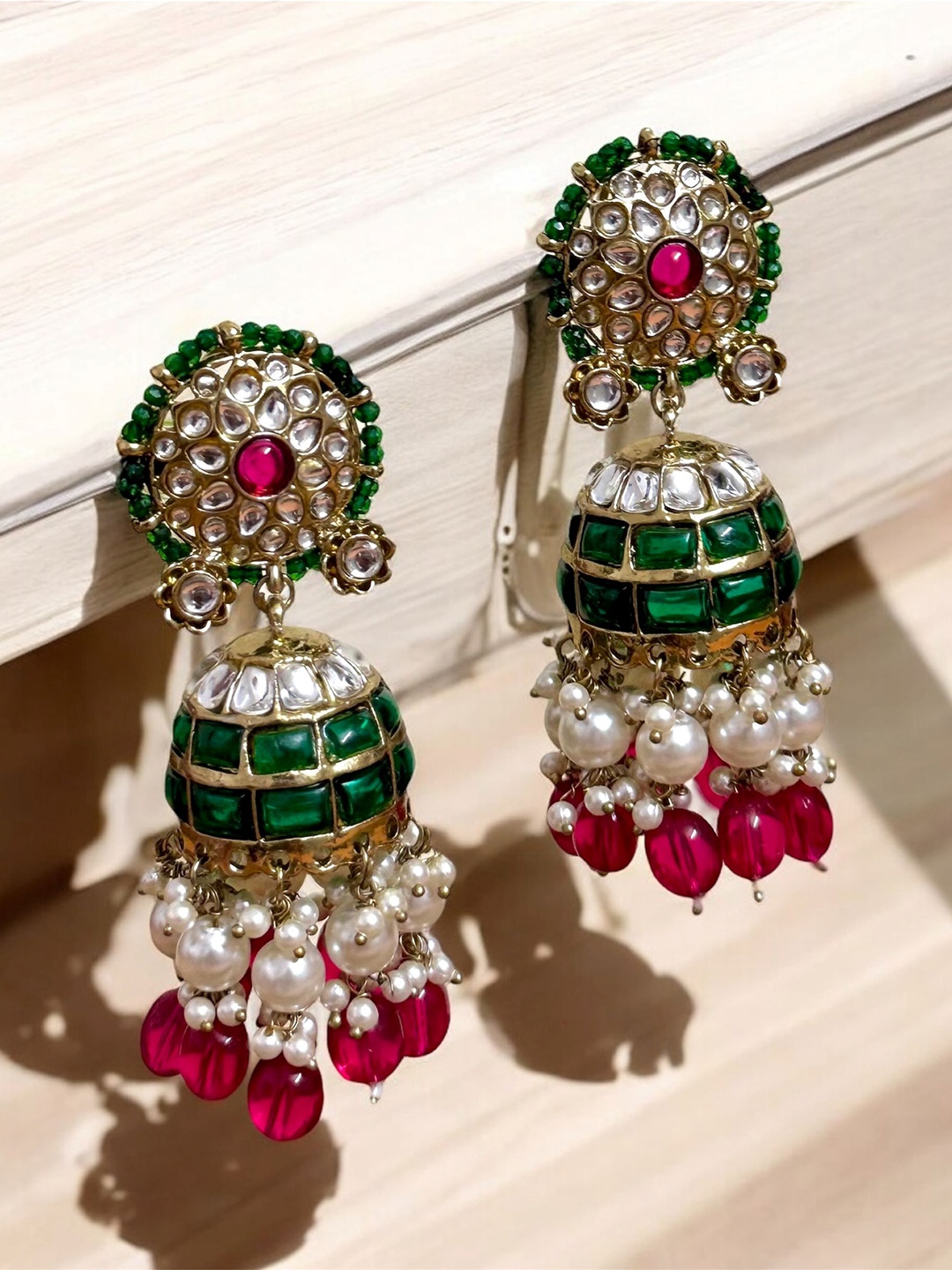 

SUBHAGALANKAR Red & Green Kundan-Studded Pearl-Beaded Gold-Plated Jhumka Earrings