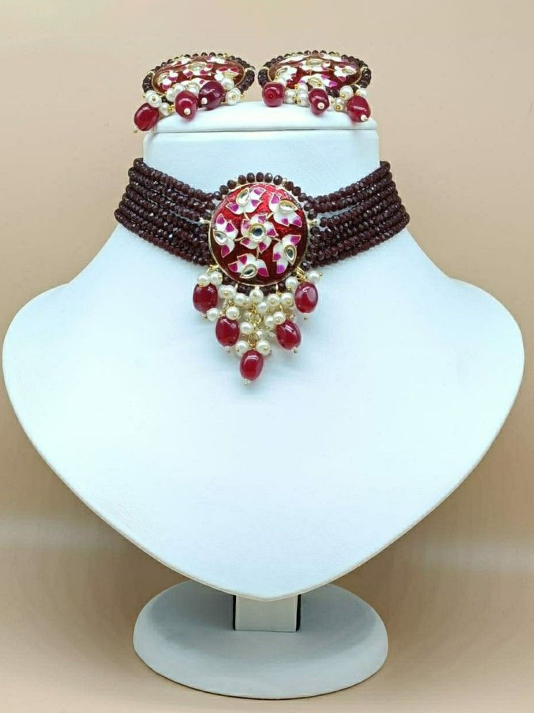 

Gyaan Jewels Gold-Pleated Artificial Stones and Beads Studded & Beaded Jewellery Set