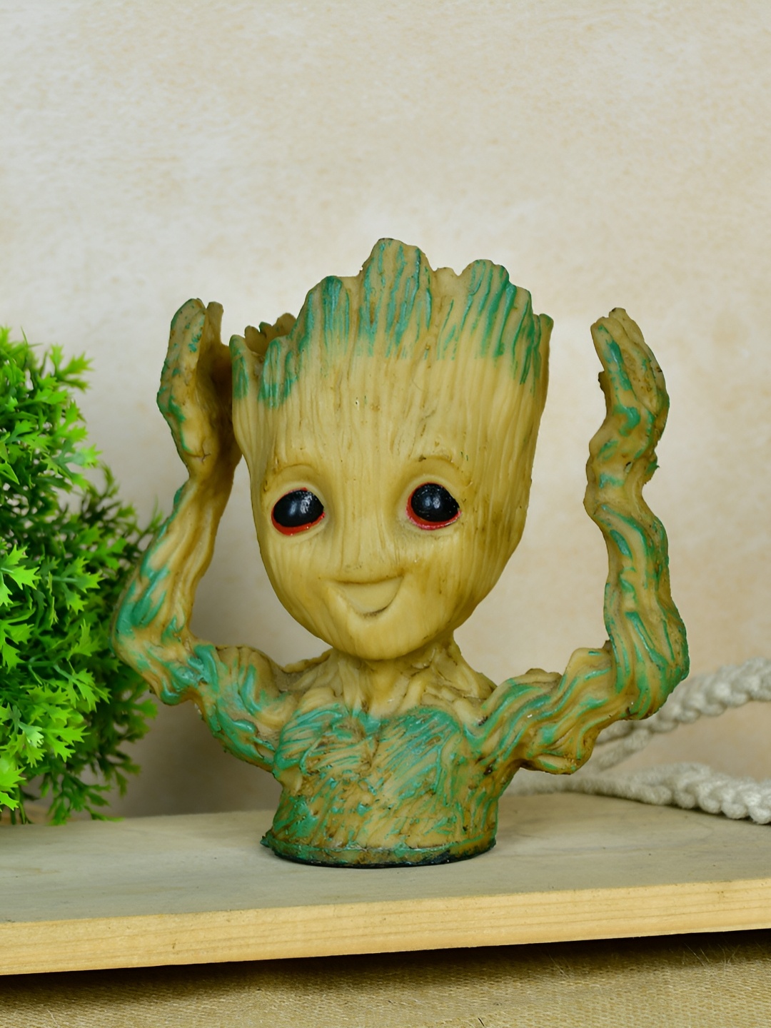 

SOWPEACE Beige & Green Printed Groot Figurine Planter With Hands Up Showpieces