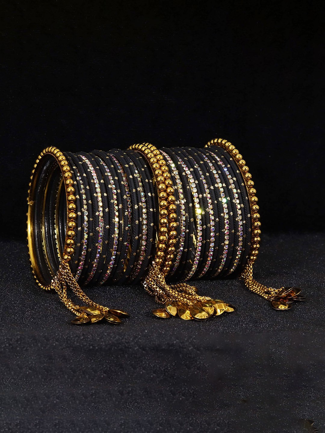 

Set of 38 Non-Precious Metal with Base Metal Zari Dotted and Rainbow Zircon Gemstone bangles, Magenta