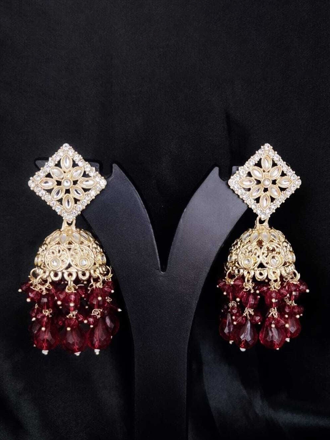 

Gyaan Jewels Artificial Stones and Beads Studded & Beaded Jhumka Earrings, Gold