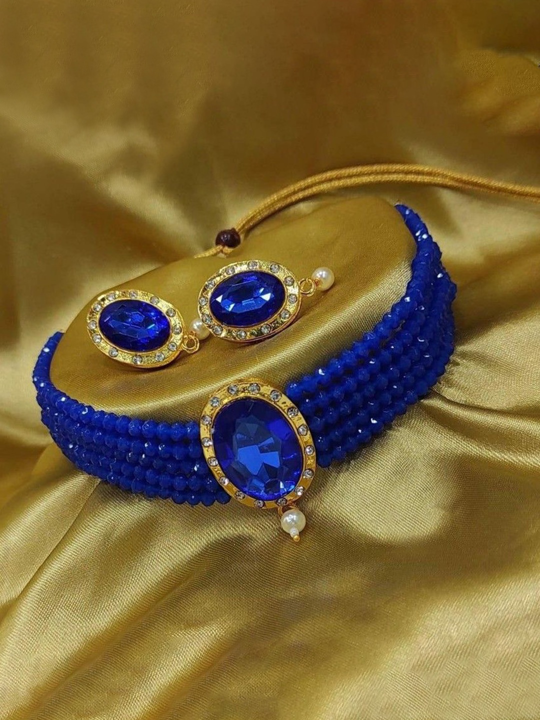 

Gyaan Jewels Artificial Stones and Beads Studded & Beaded Jewellery Set, Gold