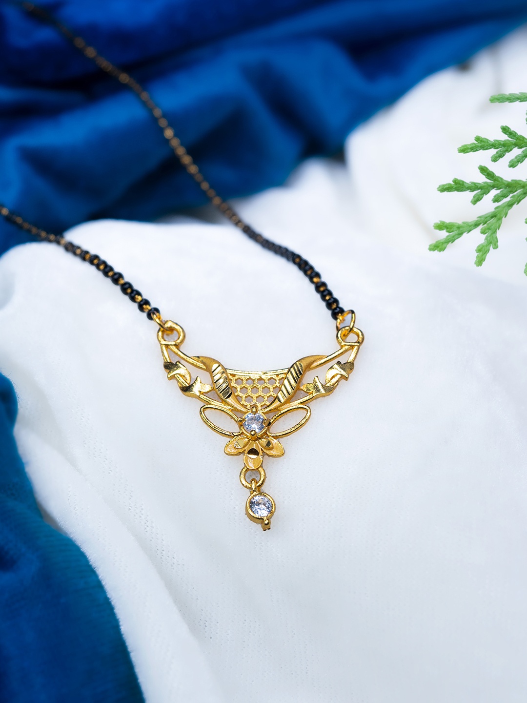 

GOLD CASH Gold-Plated Stone Studded and Beaded Mangalsutra