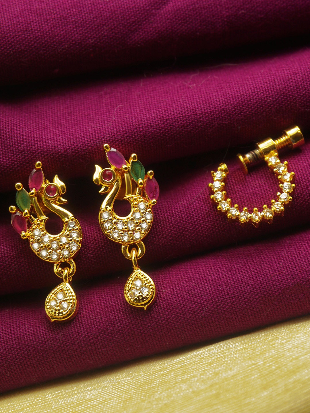 

PINAAKA DARINI 1Gram Gold-Plated Artificial Stone Studded Drop Earrings & NoseRing