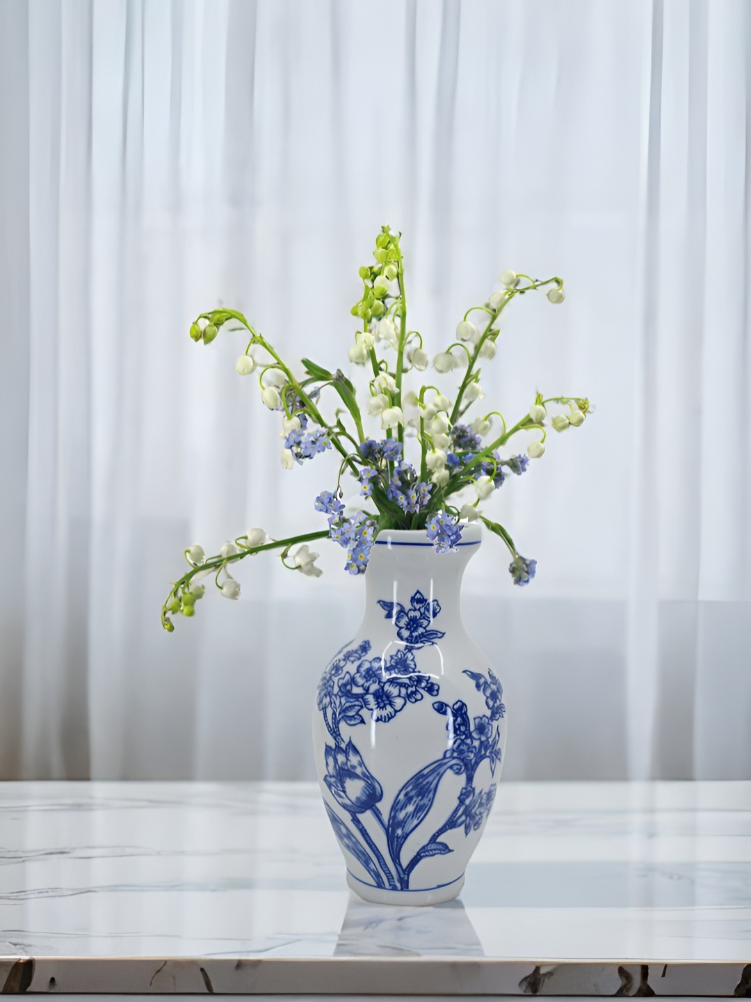 

The Decor Lane Blue & White Floral Printed Ceramic Pottery Vase