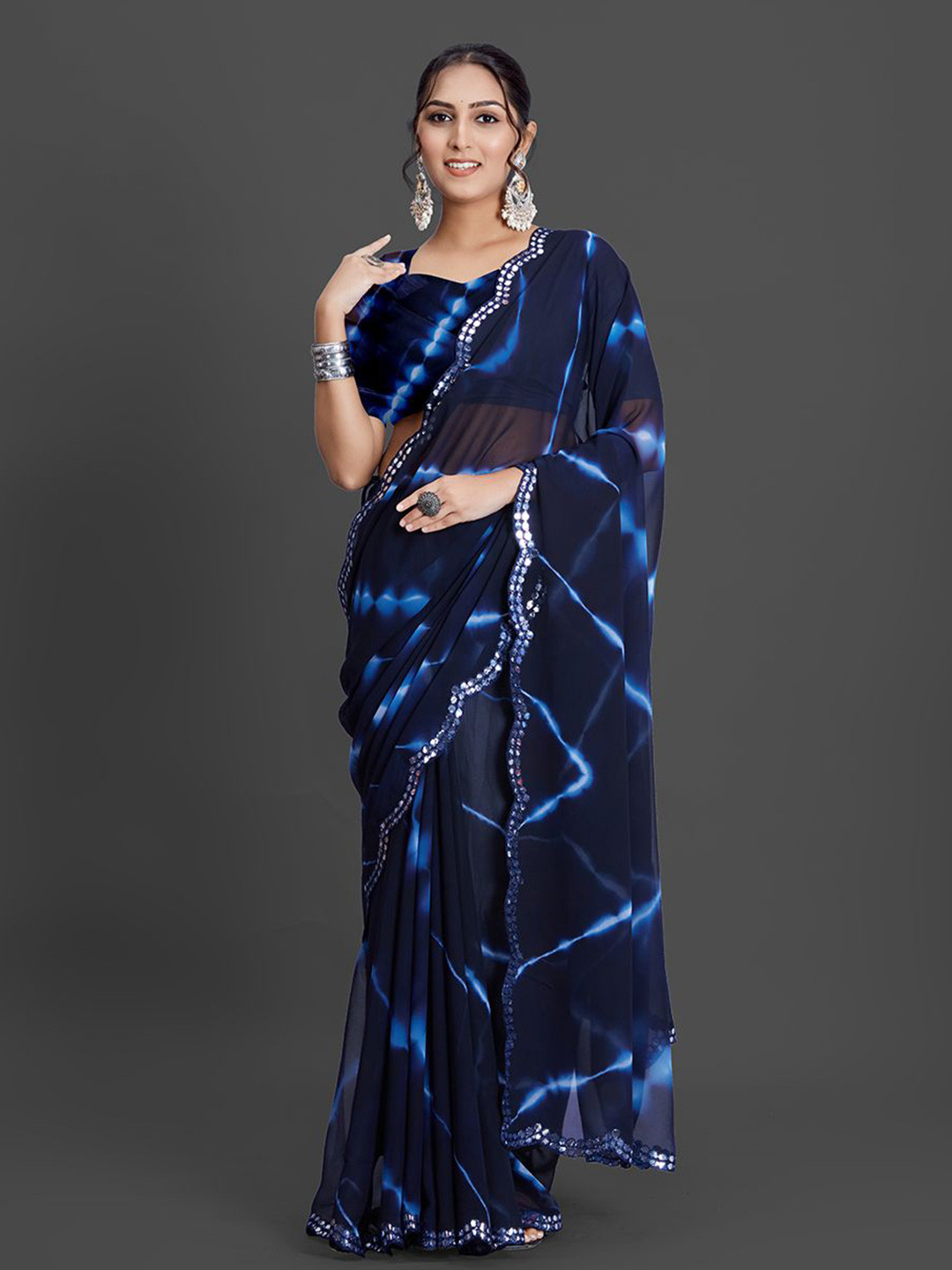 

A.V.M Prints Tie and Dye Sequinned Pure Georgette Saree, Navy blue