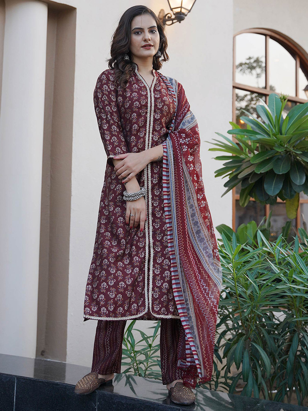 

Peachmode Women Floral Printed Regular Chanderi Silk Kurta with Trousers & With Dupatta, Maroon