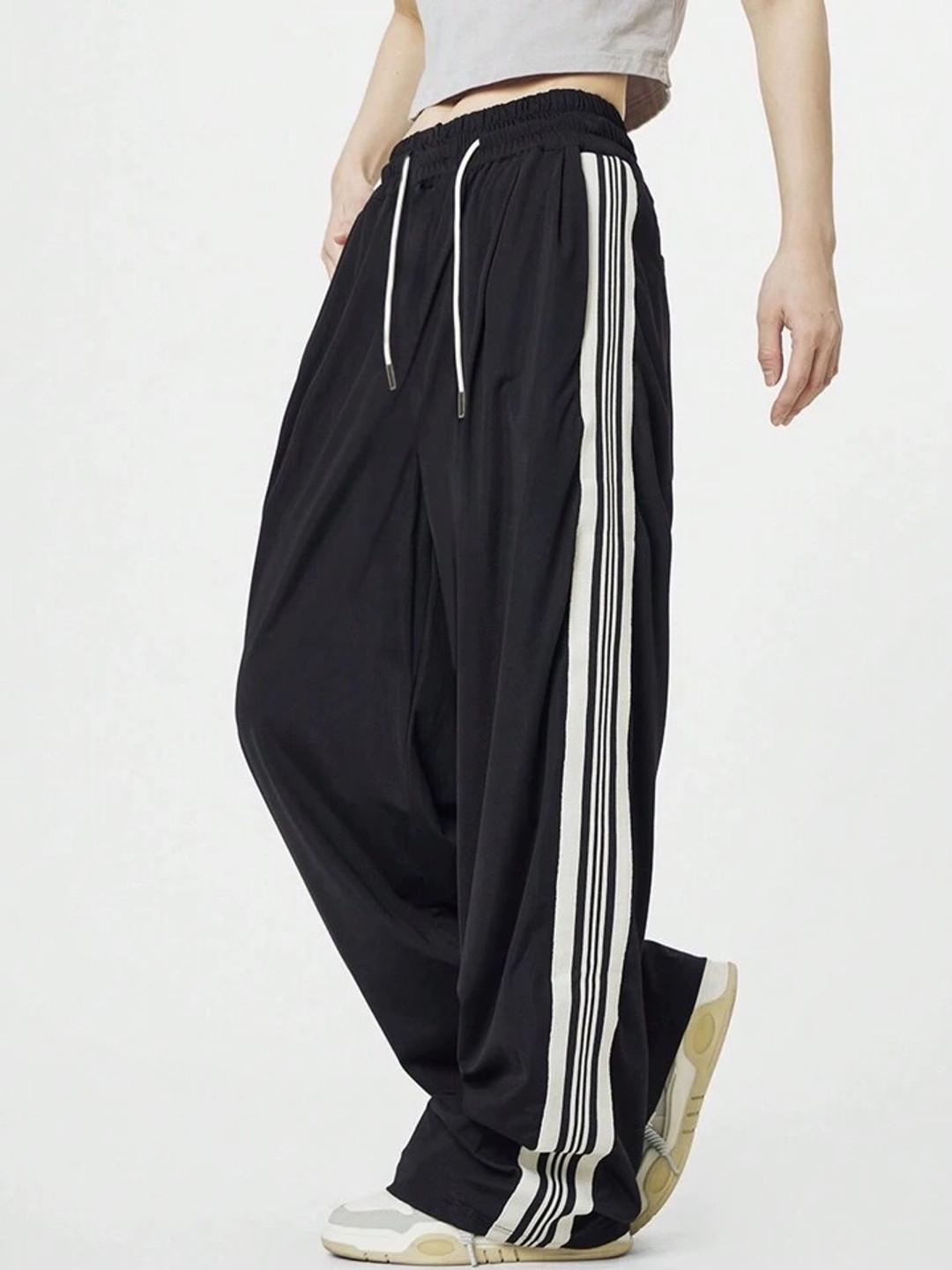 

SAAHASAM Women Striped Relaxed Loose Fit Trousers, Black