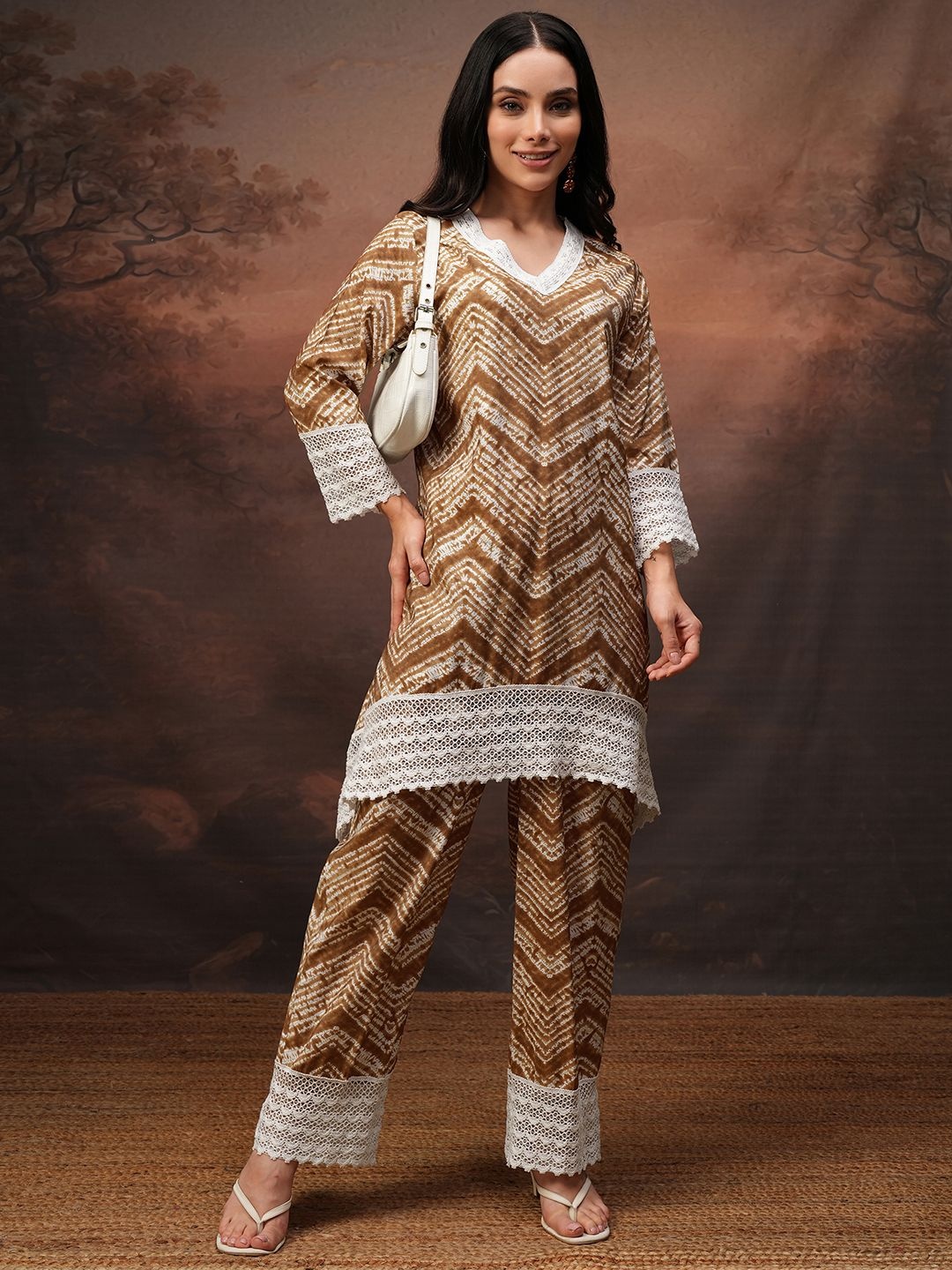 

Vishudh Coffee Brown Printed V-Neck Three-Quarter Sleeves Tunic With Trouser