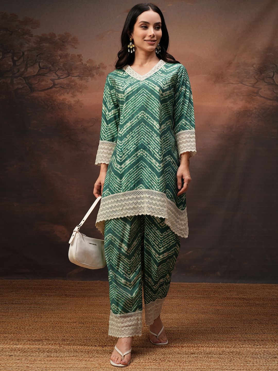 

Vishudh Green Printed V-Neck Three-Quarter Sleeves Tunic With Trouser