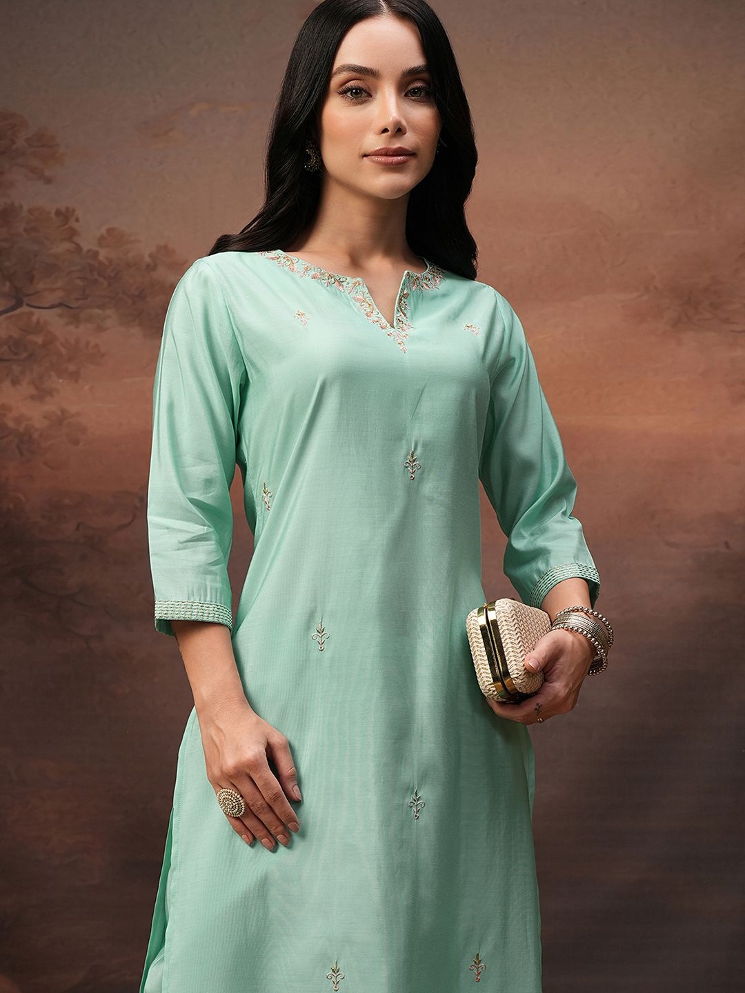 

Vishudh Turquoise Blue Embroidered Round Neck Three-Quarter Sleeves Tunic & Trouser