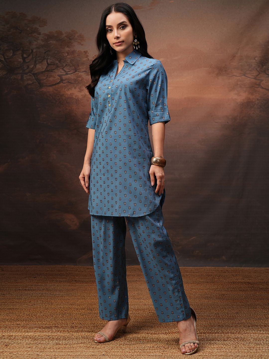 

Vishudh Teal Printed Shirt Collar Three-Quarter Sleeves Tunic With Palazzo