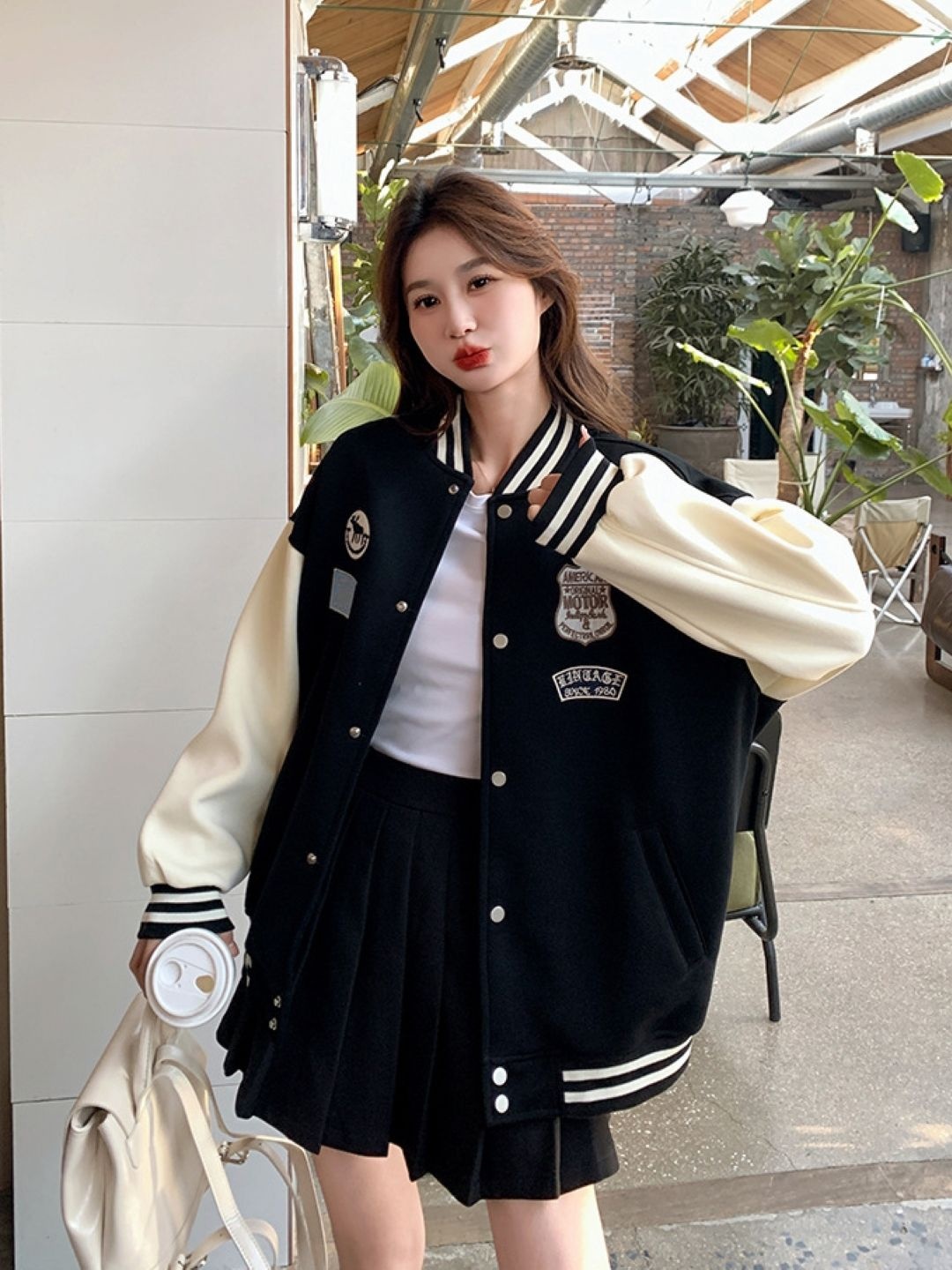 

StyleCast Women Stand Collar Colourblocked Casual Varsity Jacket, Black