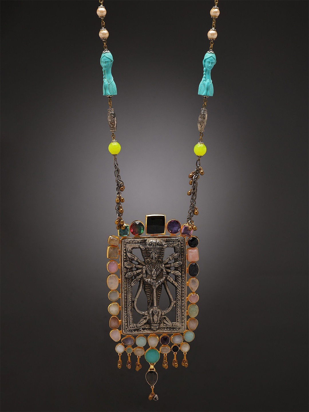 

Exotic India Zinc Tribal Goddess Durga Necklace with Multi Gemstones & Dangling Ghungroos, Silver