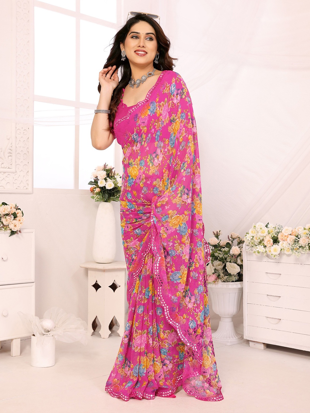 

Ambuja International Floral Printed Mirror Work Pure Georgette Saree, Pink