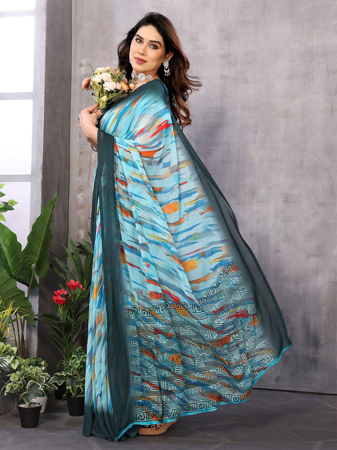 

Ambuja International Abstract Printed Pure Georgette Saree, Turquoise blue