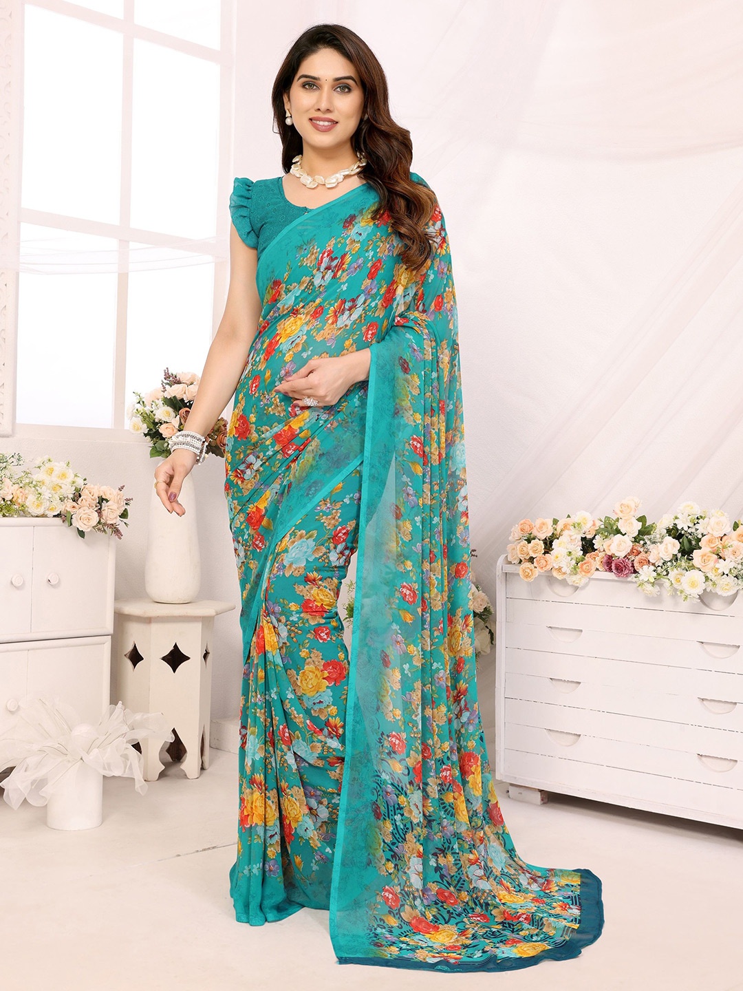 

Ambuja International Floral Pure Georgette Saree, Teal