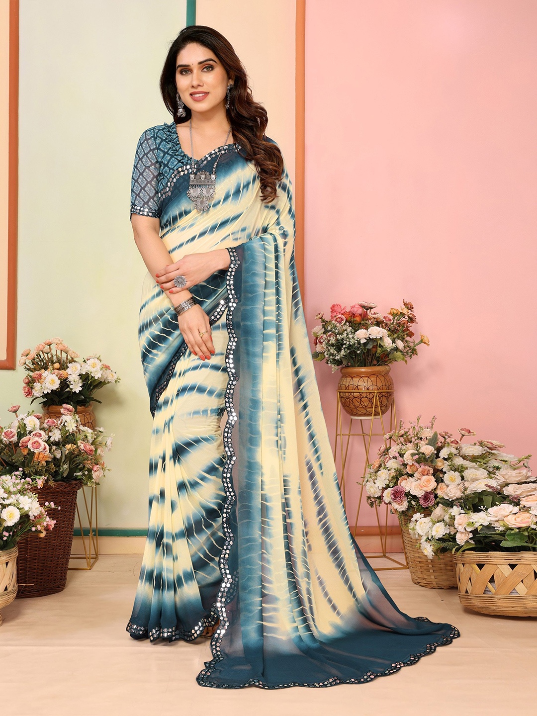 

Ambuja International Tie and Dye Mirror Work Pure Georgette Saree, Teal