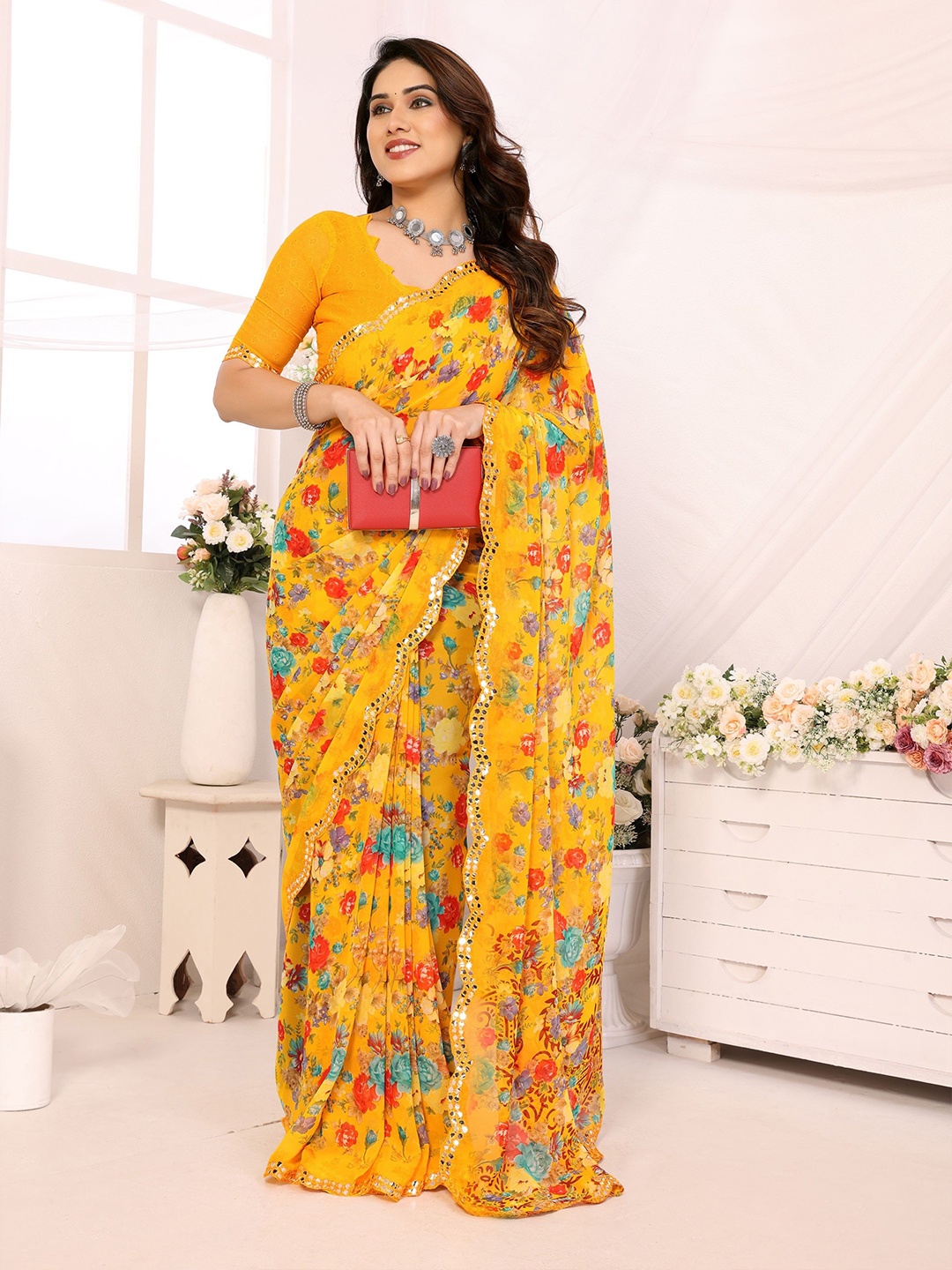 

Ambuja International Floral Printed Mirror Work Pure Georgette Saree, Yellow