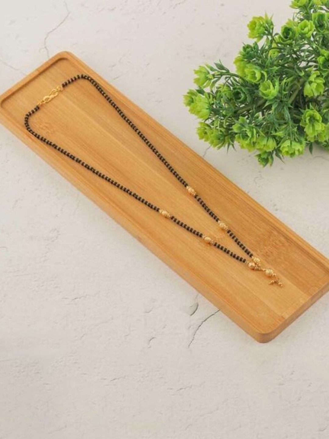 

Wynona Tanmaniya Pack Of 2 Gold-Plated American Diamond Studded Mangalsutra