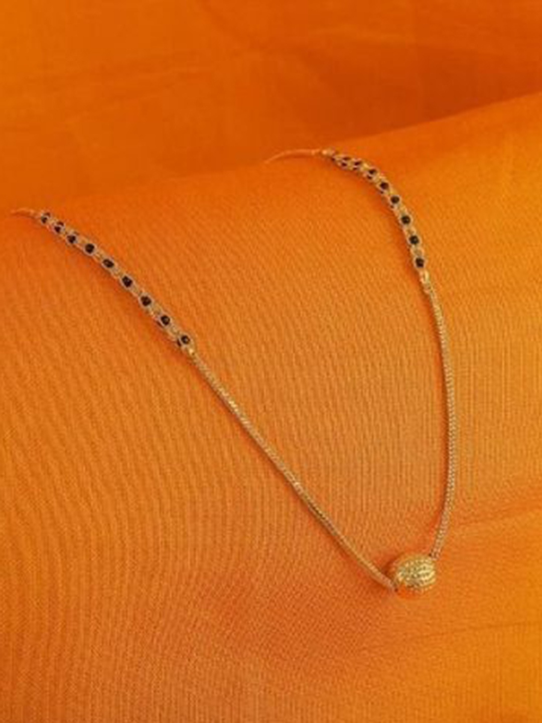 

Wynona Tanmaniya Pack Of 2 Gold-Plated American Diamond Studded Mangalsutra