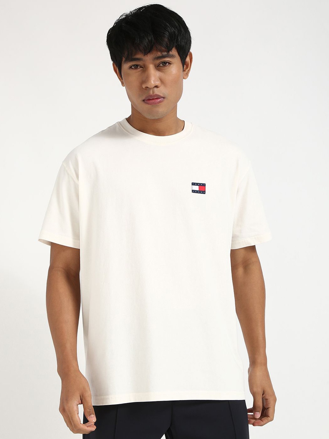 

Tommy Hilfiger Men Solid Round Neck Cotton Relaxed Fit T-shirt, Off white