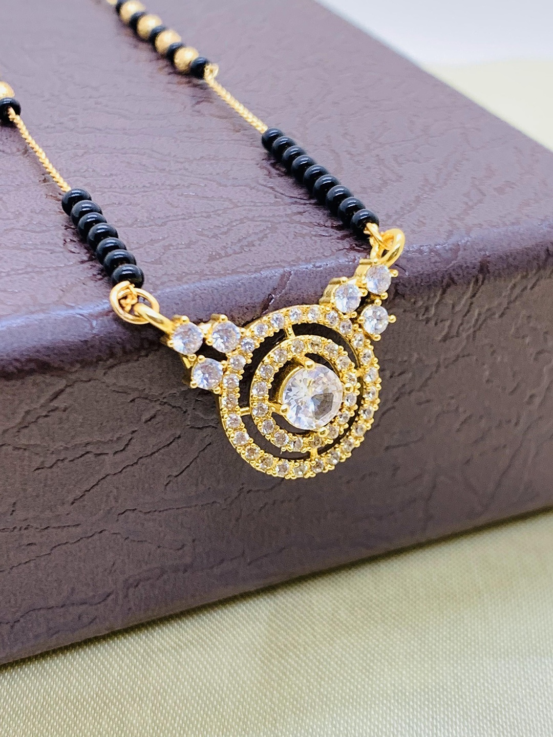 

Wynona Gold-Plated American Diamond Studded and Beaded Mangalsutra