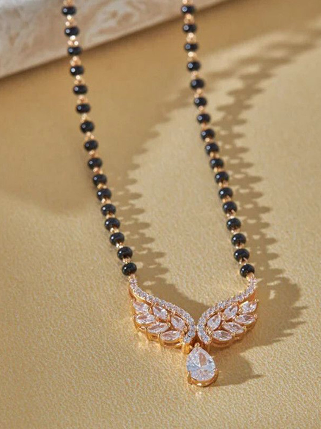 

Wynona Gold Plated Stones Studded & Beaded Mangalsutra