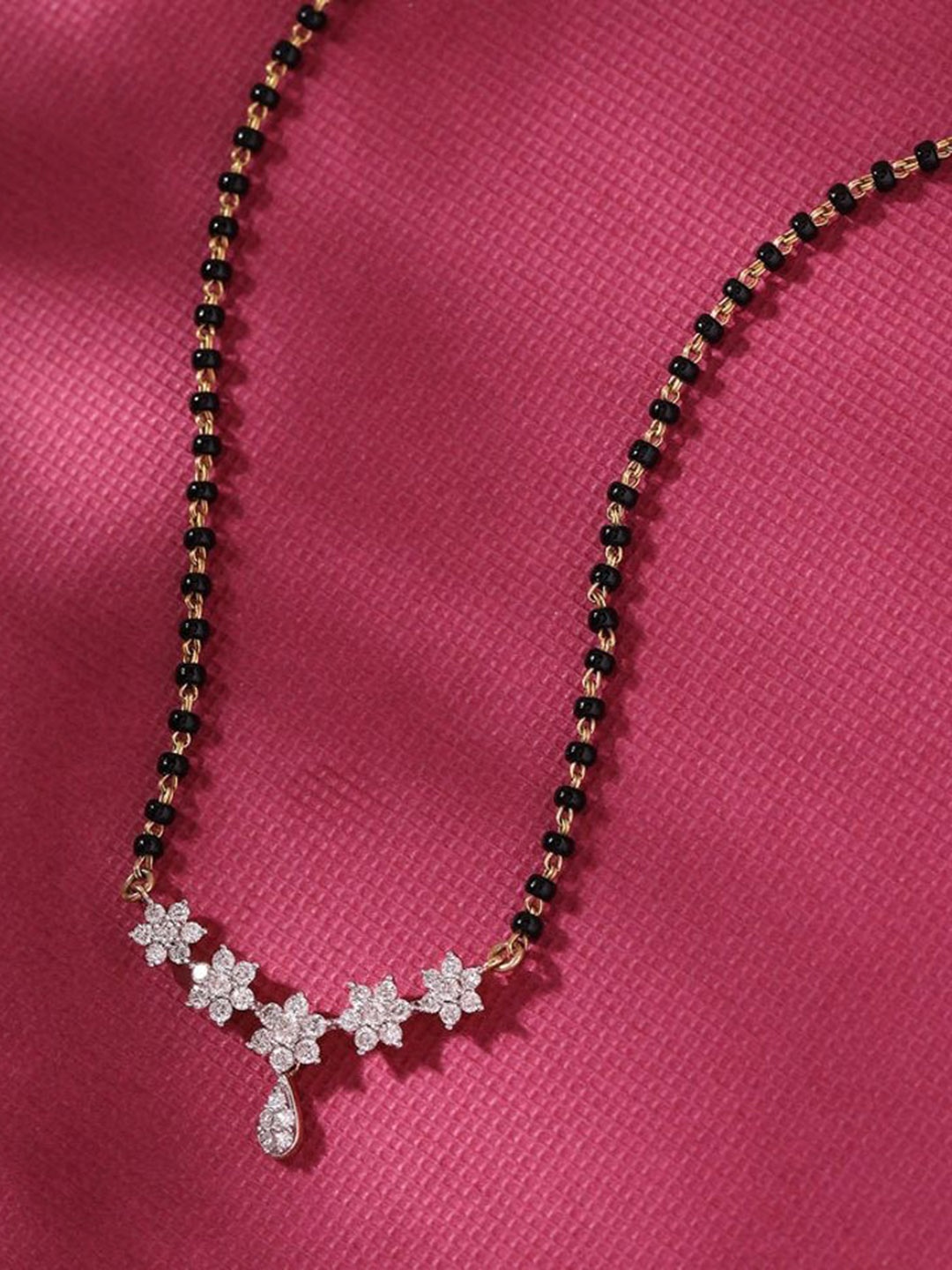

Wynona Gold-Plated American Diamond Stone Studded & Beaded Mangalsutra