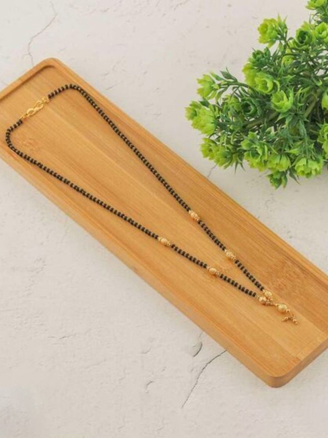 

Wynona Tanmaniya Pack Of 2 Gold-Plated American Diamond Studded Mangalsutra