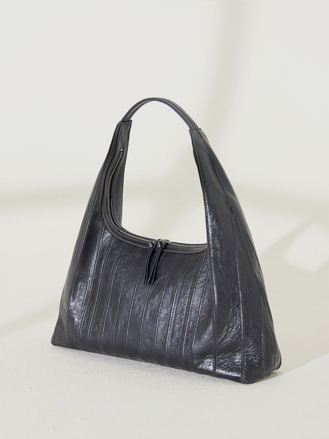 

the Misnomer Unisex Textured Leather Oversized Handheld Bag, Black