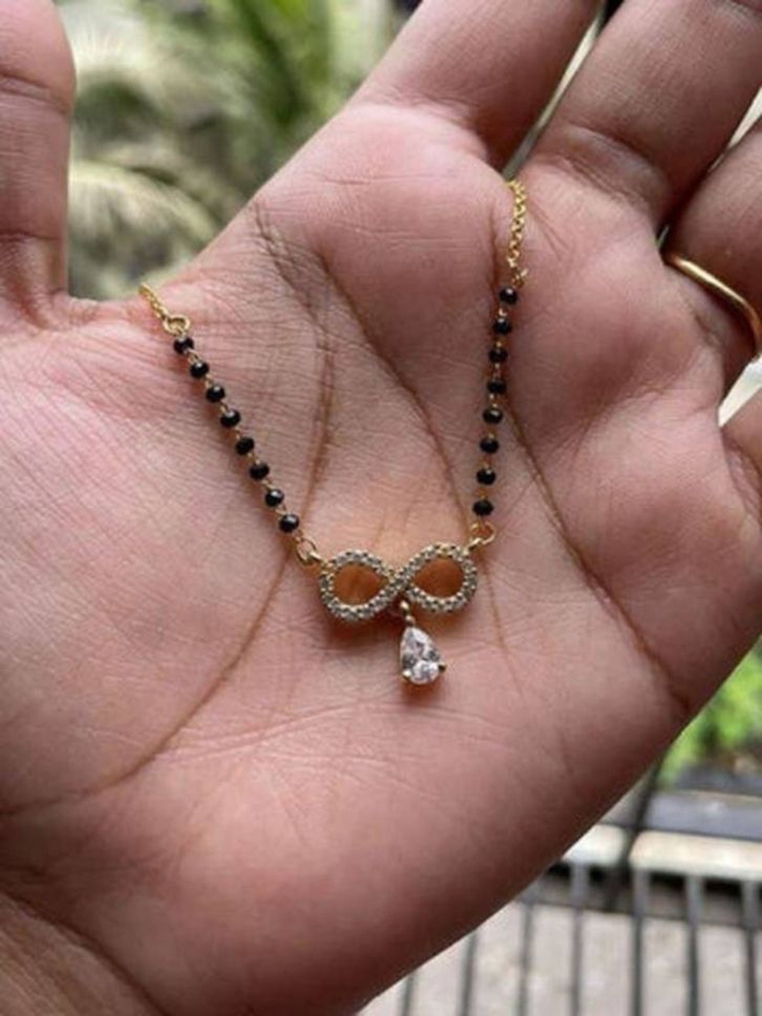 

Wynona Gold-Plated American Diamond Stone Studded & Beaded Mangalsutra