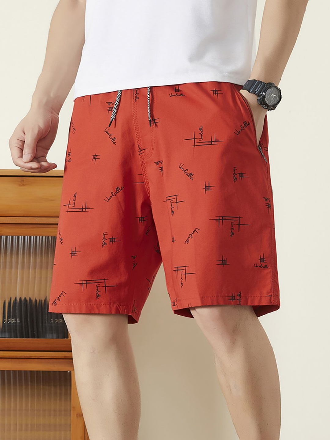 

StyleCast x Revolte Men Printed Mid-Rise Shorts, Red
