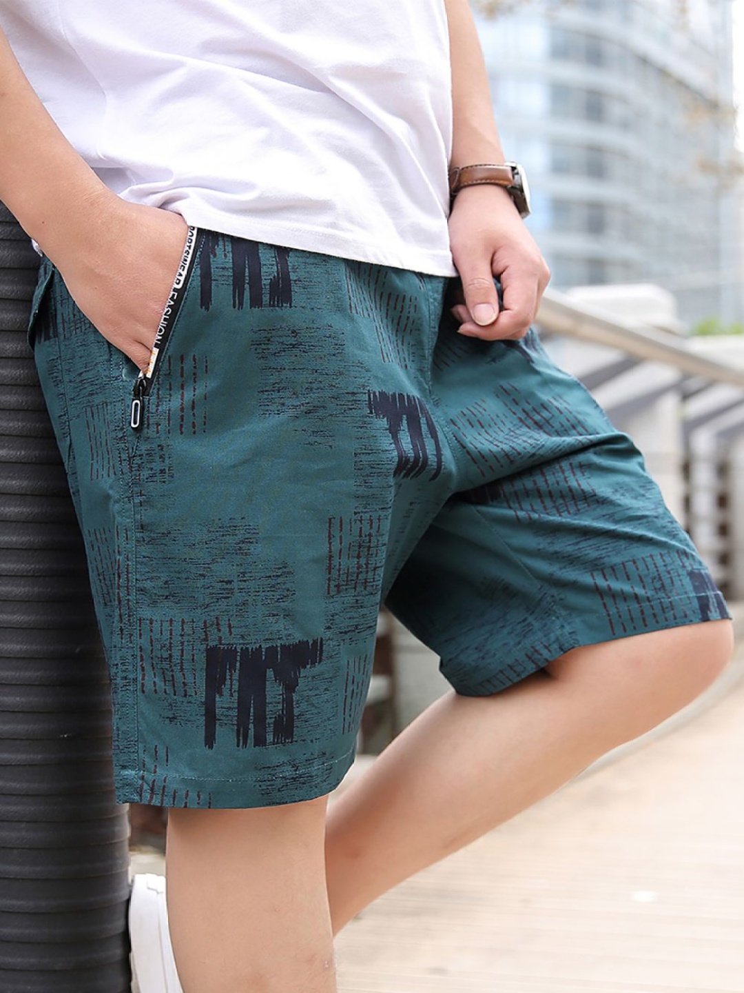 

StyleCast x Revolte Men Printed Mid-Rise Cotton Shorts, Green