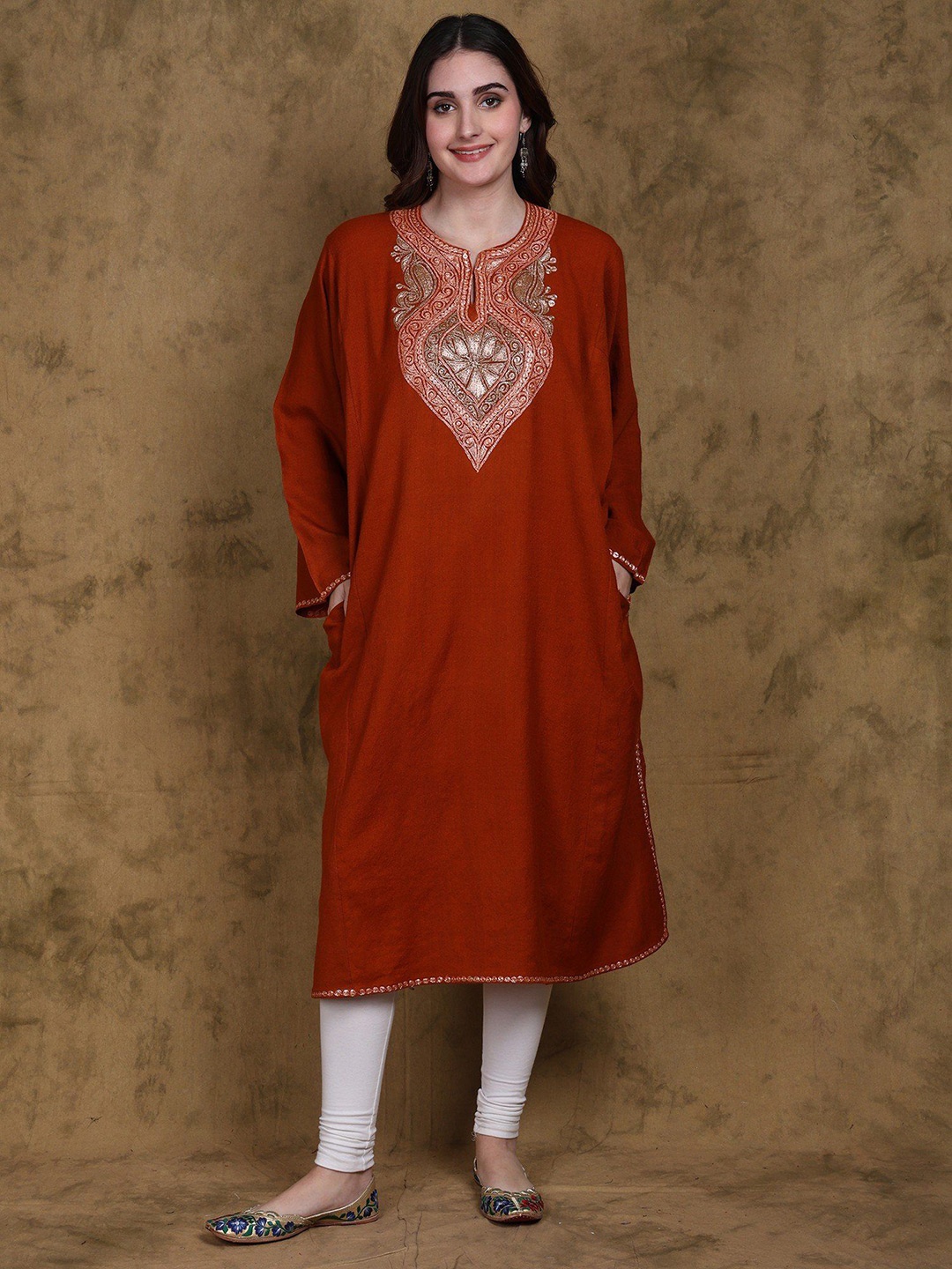 

Exotic India Bombay Wool Phiran Kurta from Kashmir with Tilla Embroidery Side Pockets, Orange