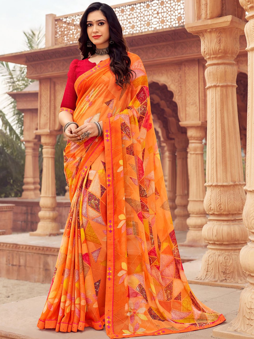 

Mitera Women Ethnic Motifs Beads and Stones Poly Chiffon Saree, Orange