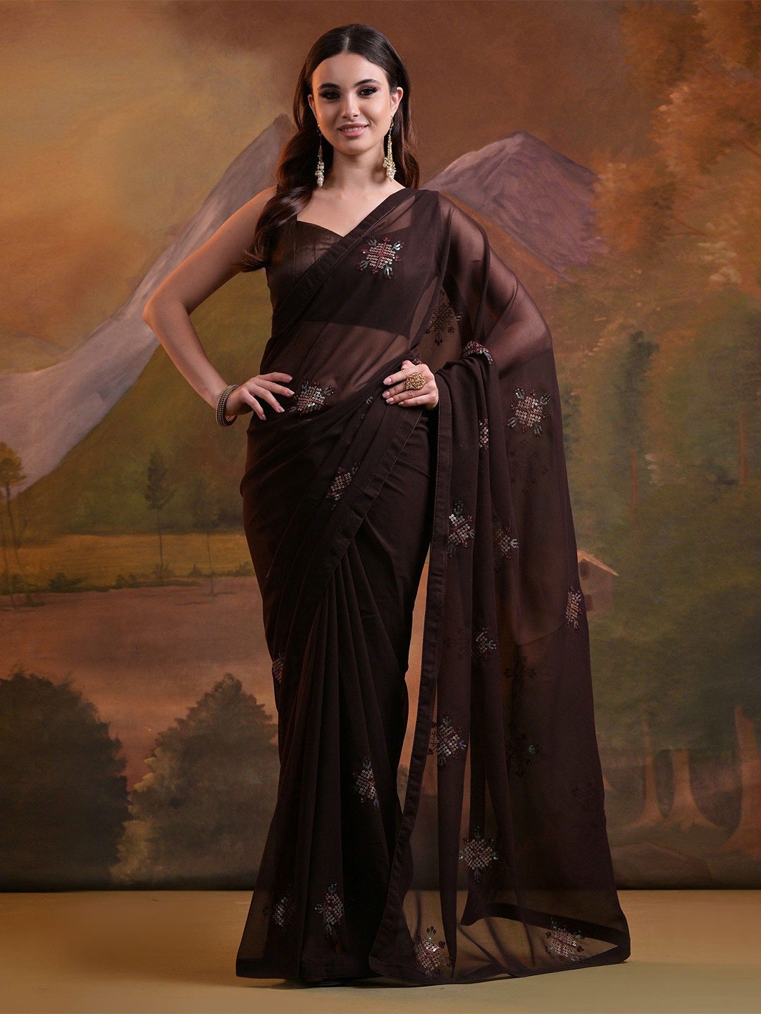 

Peachmode Floral Brown Sequinned Pure Georgette Saree