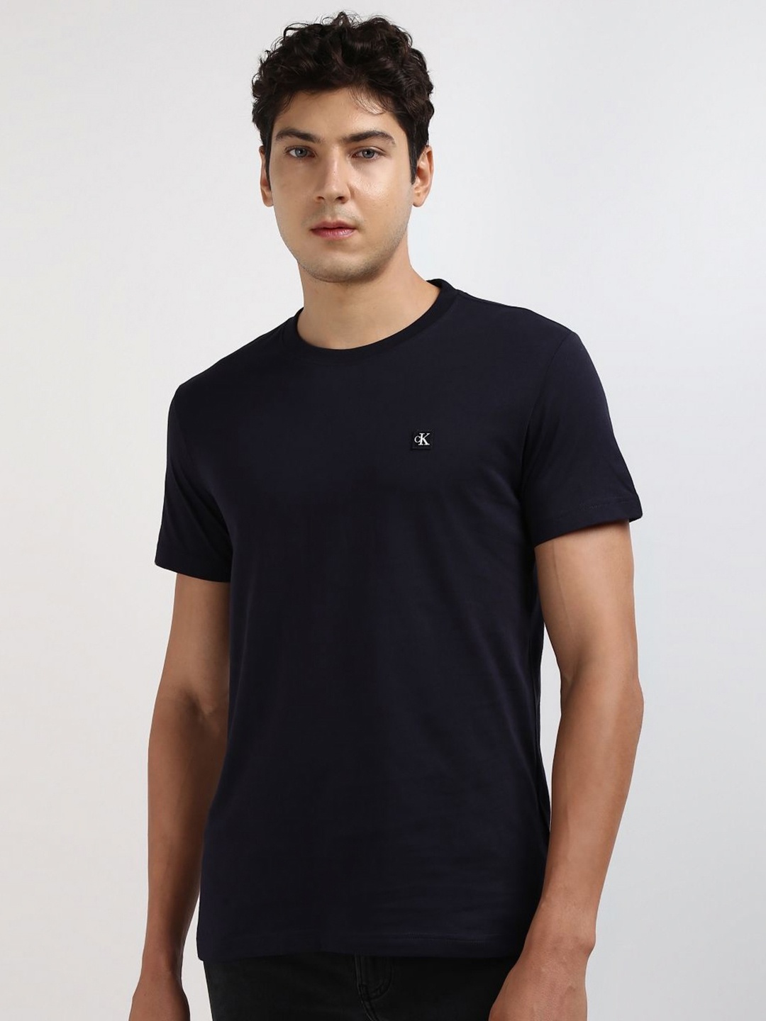 

Calvin Klein Jeans Men Solid Round neck Cotton T-shirt, Navy blue